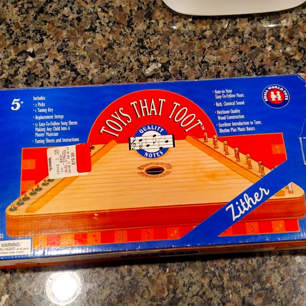 Kids wooden zither, from the  early 2000's. Still in original box, like new.